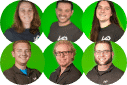 Employees smiling with a green background