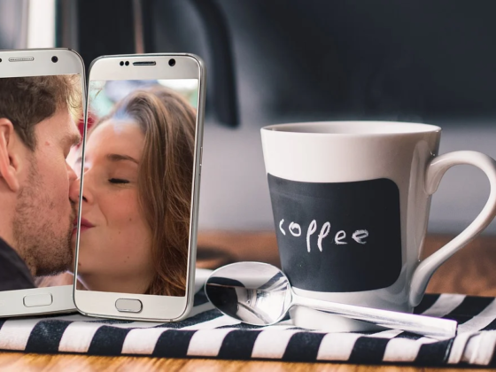 two people kissing through the iphone