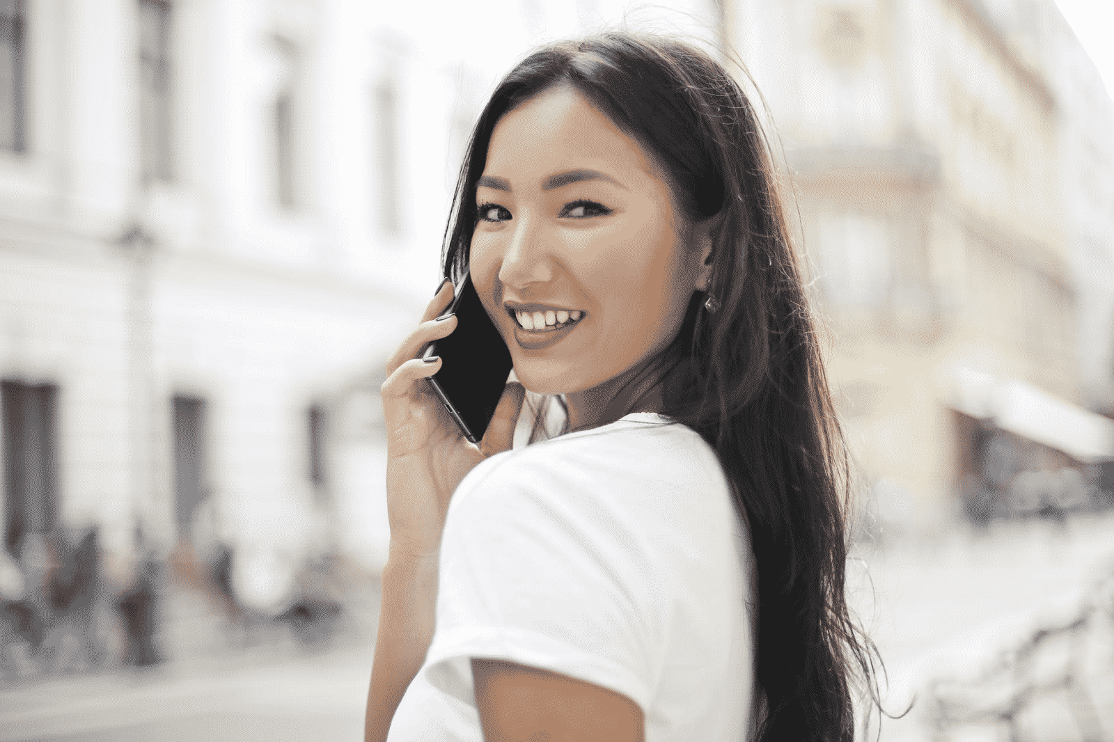 girl smiling with a phone